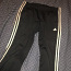 Adidase laiad püksid (foto #1)