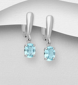 Серебряные серьги 925 пробы с голубым топазом (3 фото из 4)