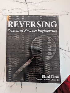 REVERSING Secrets of Reverse Engineering (1 foto / 1)