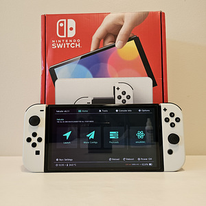 Nintendo Switch OLED CFW + 35 mängu + 256GB SD (2 foto / 2)