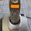 Настольный беспроводной телефон Panasonic KX-TG1100 серебрис (фото #1)